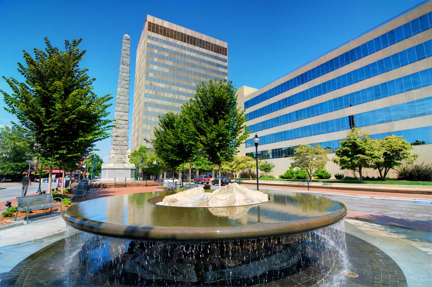 a city square with a fountain