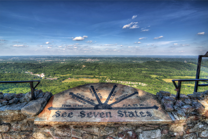 the view from above on the valley with direction for seven states on the stone