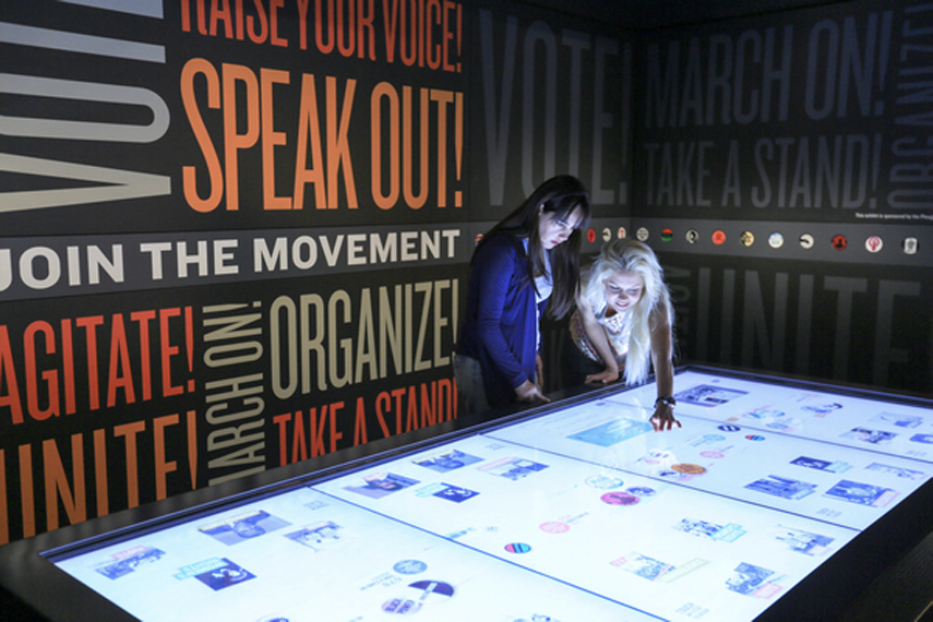 two women are looking at table screen