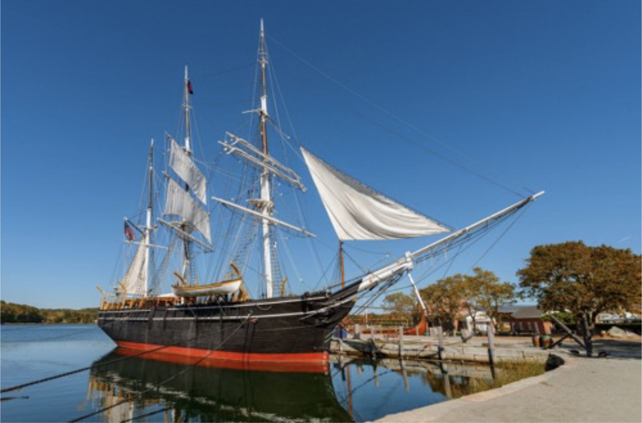 a big sail boat at the dock