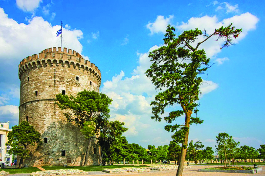 an old brick tower with the flag on top