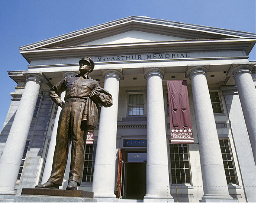 MacArthur Memorial building with the statue of the man in front of it