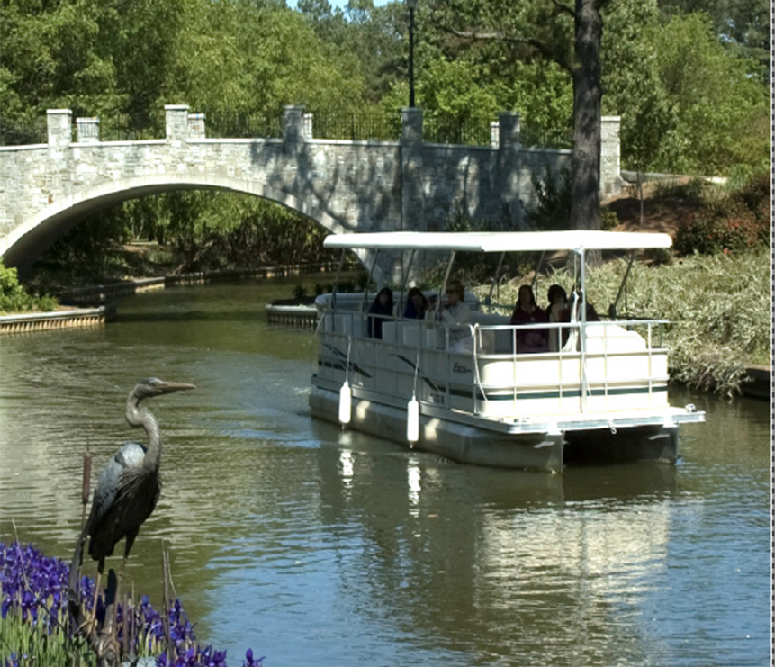 people are riding the small river boat