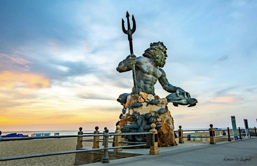 a stone statue of Poseidon